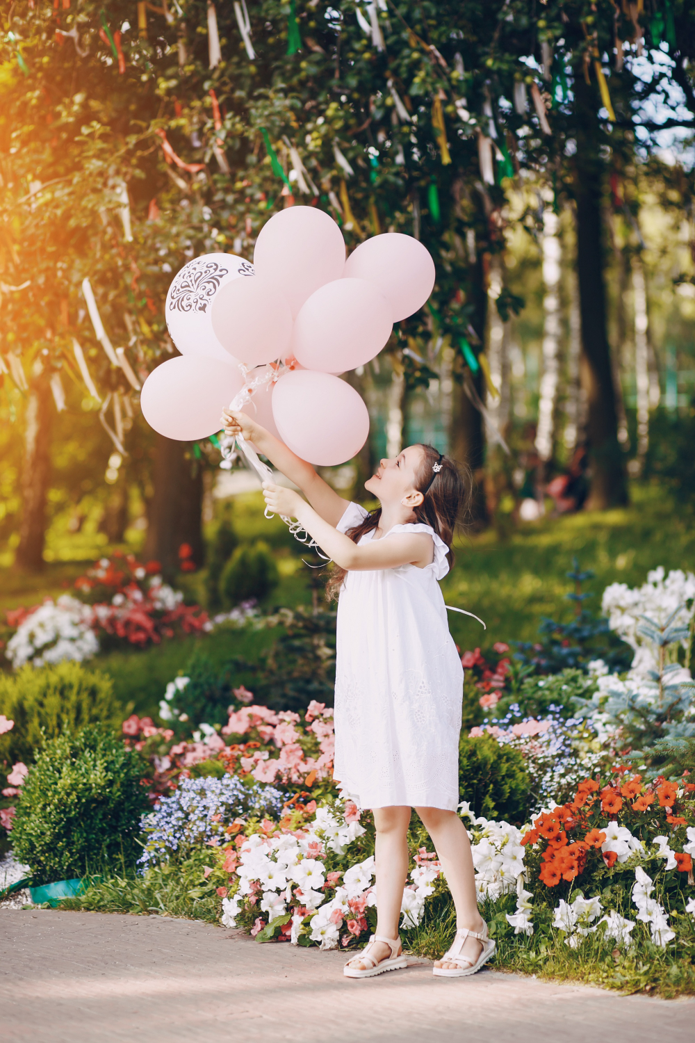 Kid holding balloon for mother gift